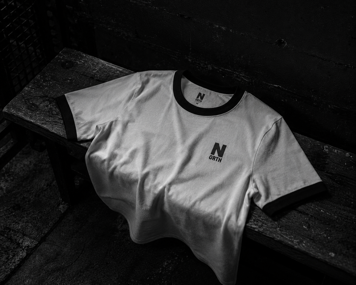 NORTH ringer tee on a bench
