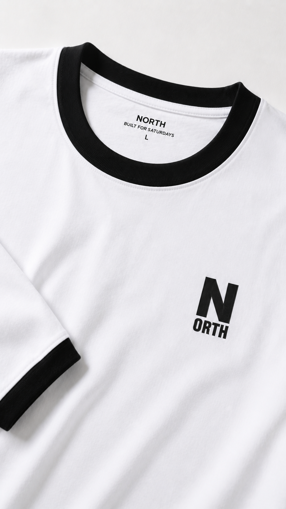 White NORTH ringer tee with black collar and cuffs